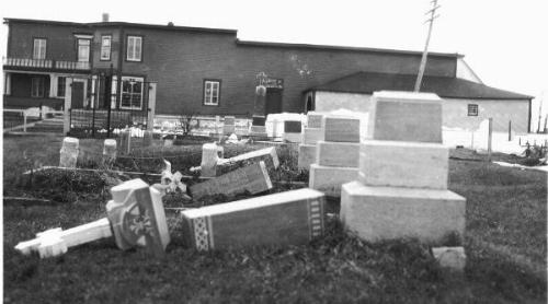 Photo 2012-082: Tombstones from the Rivière-Ouelle cemetery overturned during the Charlevoix earthquake of March 1, 1925 - Hodgson (1950) and Bruneau and Lamontagne  ...