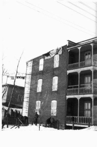Photo 2012-083: Exterior masonry wall of an apartment building in Shawinigan that was damaged during the Charlevoix earthquake of March 1, 1925 - Hodgson (1950) and  ...