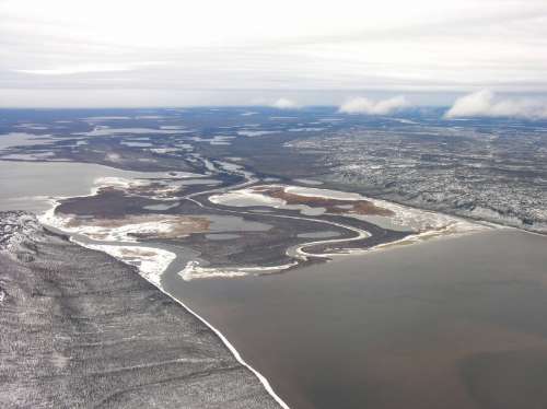 Photo 2014-023: Aerial view southwestward across Campbell Lake toward the Mackenzie River -the lake occupies a segment of the Sitidgi Graben, part of an extensional  ...