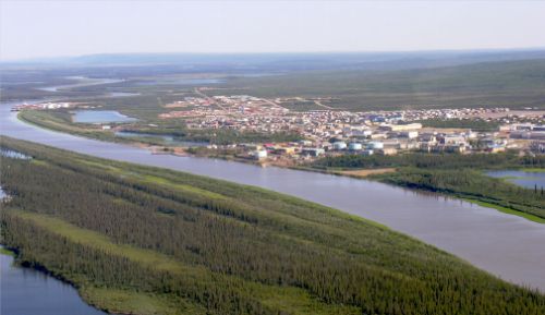 Photo 2014-024 : Aerial view of the town of Inuvik, looking northward past East Channel of the Mackenzie River and the waterfront, taken 11 July 2007 - Inuvik is the  ...
