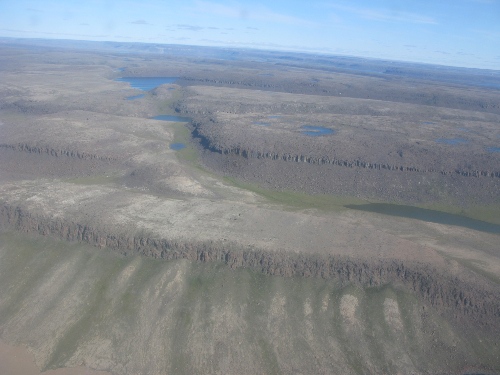 Photo 2014-144: View west of shore south of Ulukhaktok (Victoria Island NWT) showing block faulting of Franklin Sills