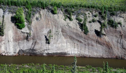 Photo 2015-108 : Aerial view of open anticline at Station 10LHA166HE, exposed in the south-facing cut-bank on Rock River - although light coloured sandstone beds near  ...