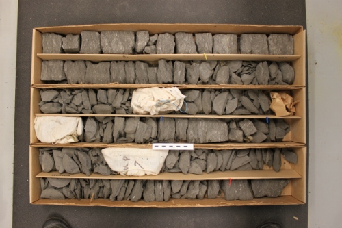 Photo 2019-473: Photographs of core 3, Skolp E-07 showing the core boxes. The rubbly core materials recovered from the base of the well have been bagged. Scale bars  ...