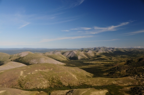 Photo 2019-531 : View northwestward from Cambrian Shales in the core of the Richardson Mountains toward west-dipping Ordovician and Silurian limestones of the Road  ...