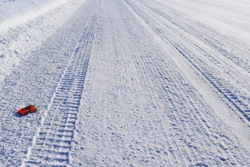Photo 2020-332 : The surface characteristics of ice roads vary continuously due to traffic activity and maintenance practices such as flooding, grooving, and sanding.  ...