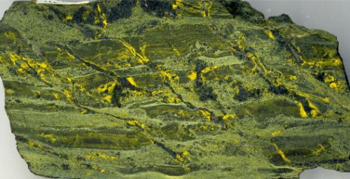 Photo 2020-740: Cobaltinitrite-stained rock slab of repeated pulses of HT Ca-Fe and HT Ca-K-Fe alteration and veining of metasiltstone within the NICO deposit.  ...