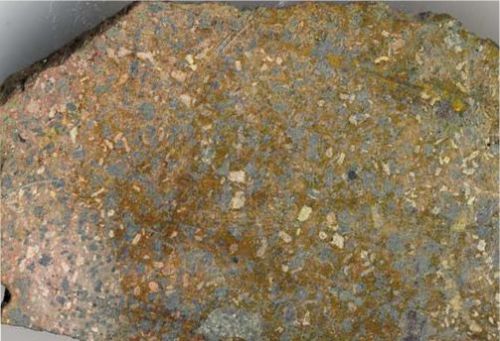 Photo 2020-762: Cobaltinitrite-stained rock slab of K-felsite breccia replacing albitized porphyritic andesite due north of Mile Lake, Port Radium-Echo Bay district.